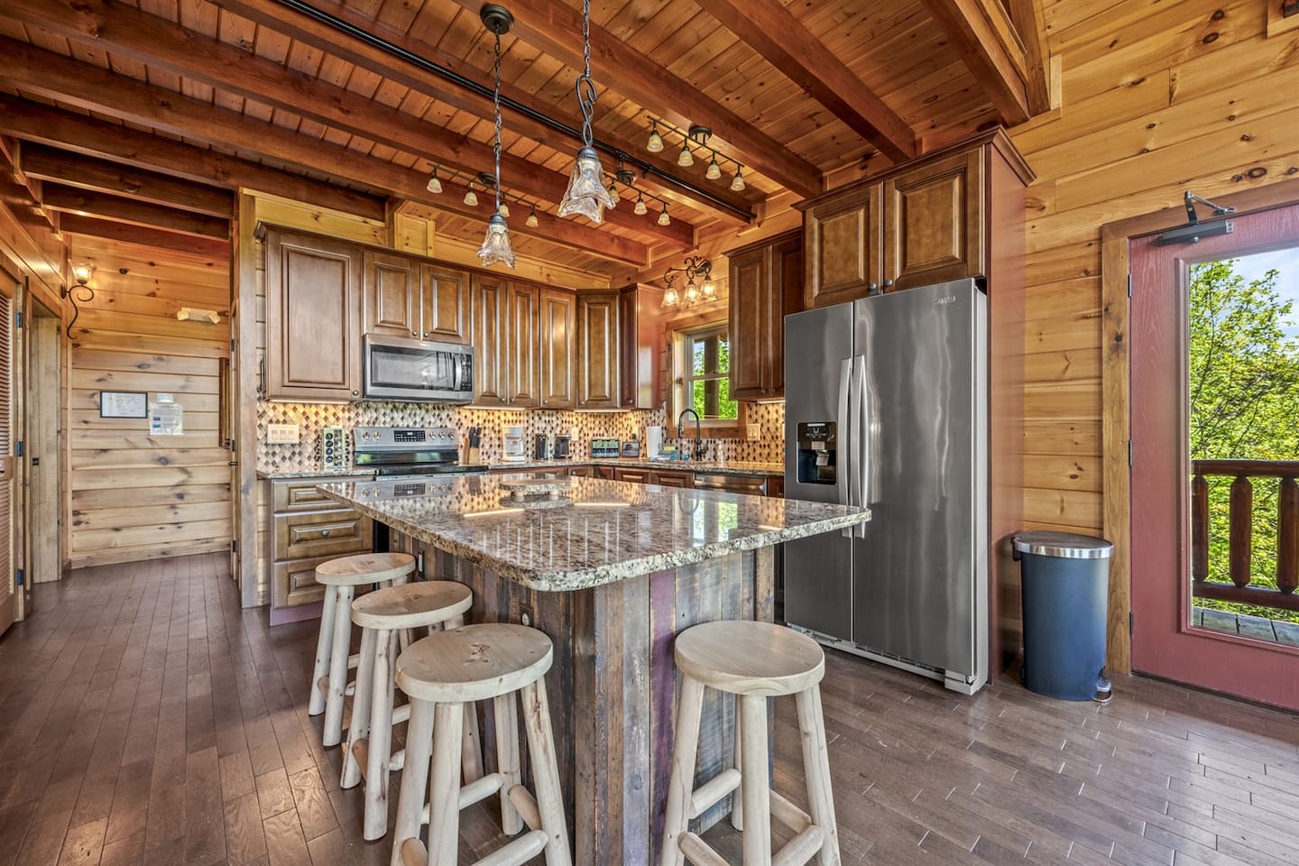 Up to date kitchen with soft close cabinets, stainless appliances and granite