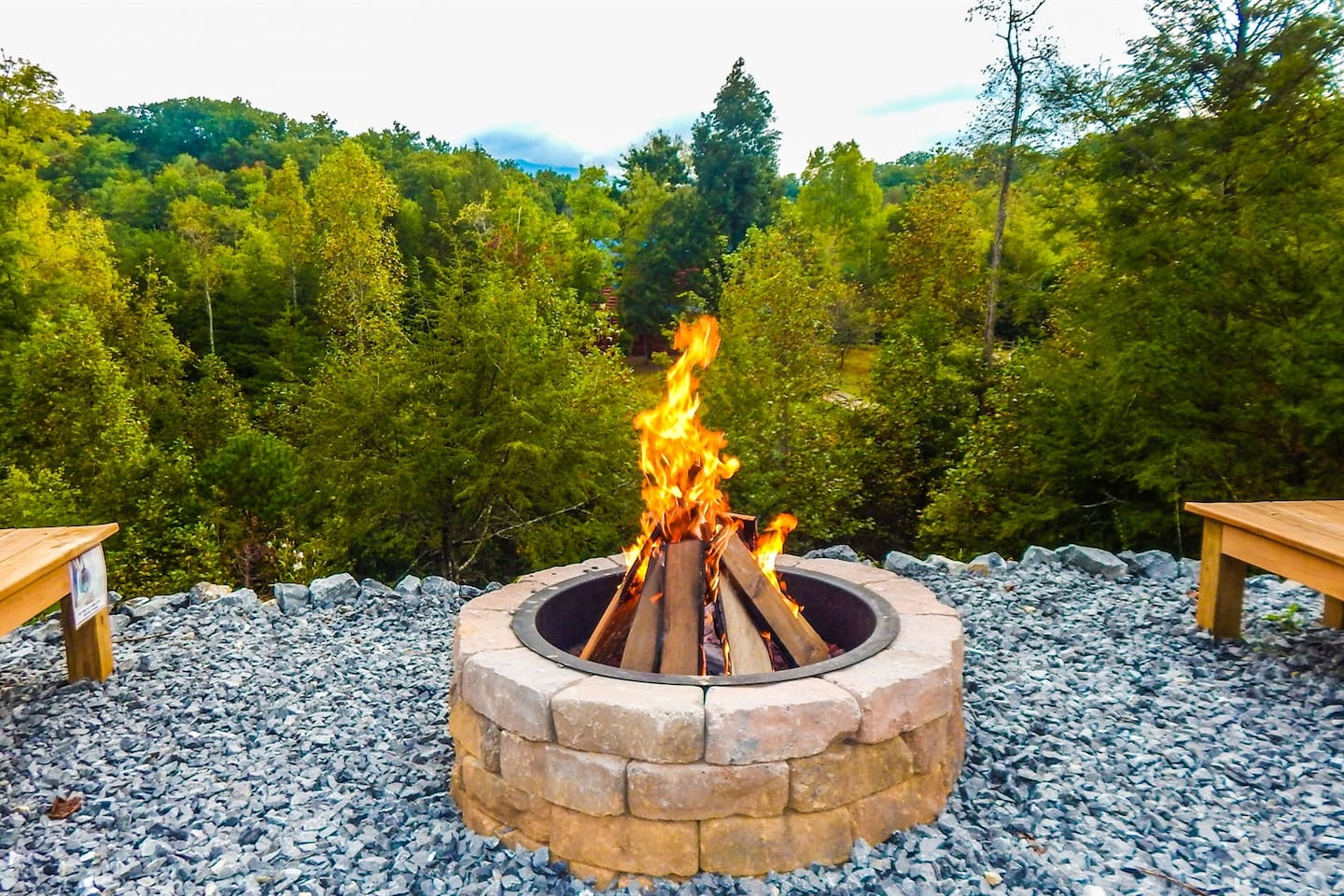 Firepit with seating overlooks nature