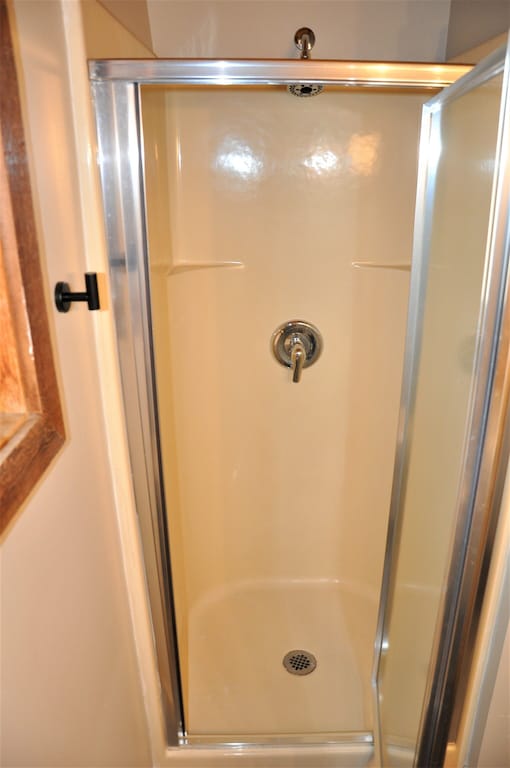 Upper level full bathroom with shower.