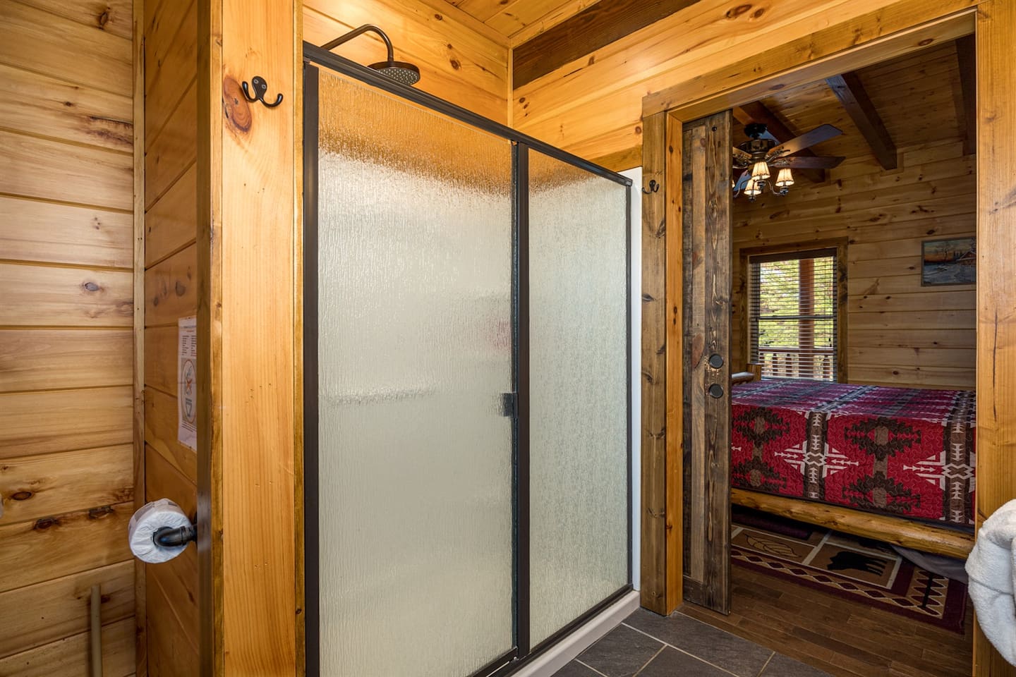 Main floor bath with walk in shower, dual custom vanity & heated floors